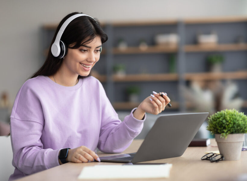 woman-in-headphones-having-video-call-using-laptop-2026-01-08-23-20-42-utc (1)